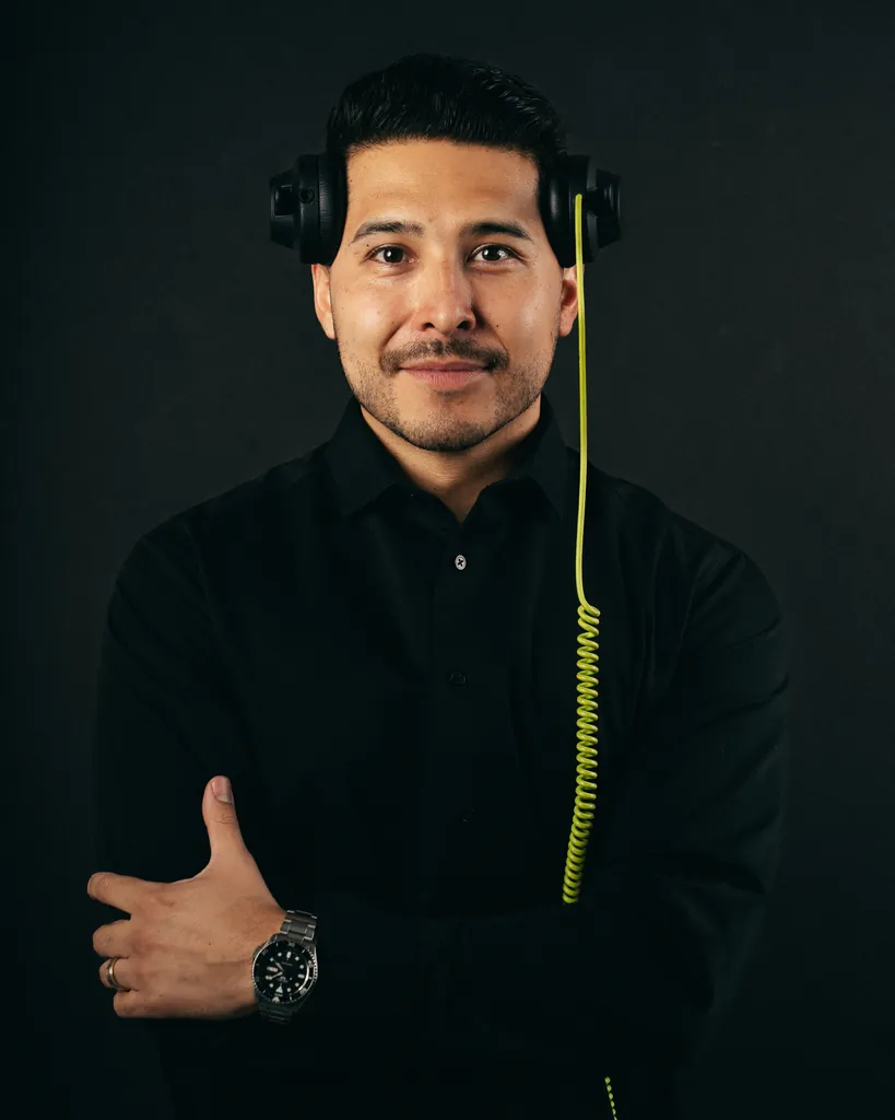 Fabian, DJ Lowso, wearing headphones against a dark background
