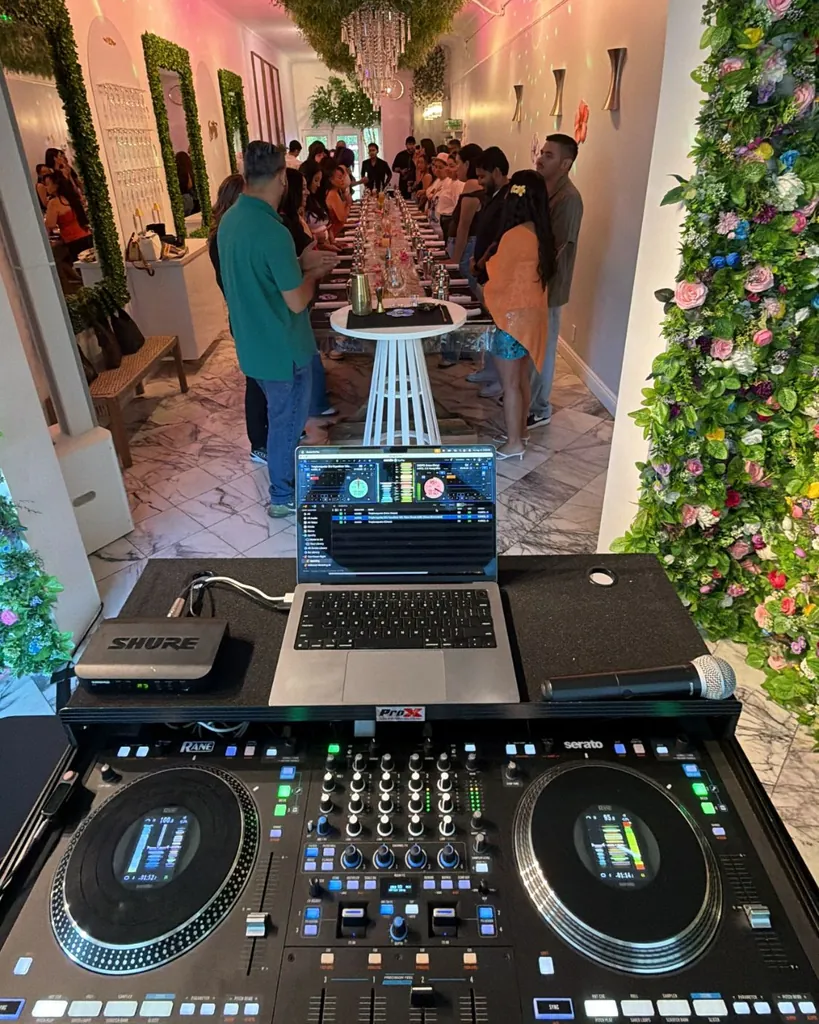 DJ Lowso’s controller and laptop in the foreground of a Mixology Masterclass for SoCal Bartenders & Servers